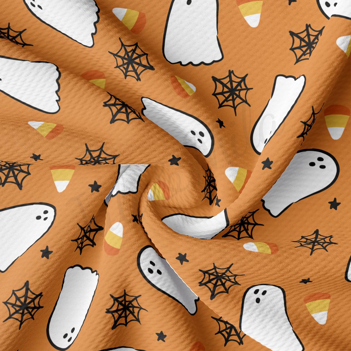 a pattern of ghost and stars on an orange background