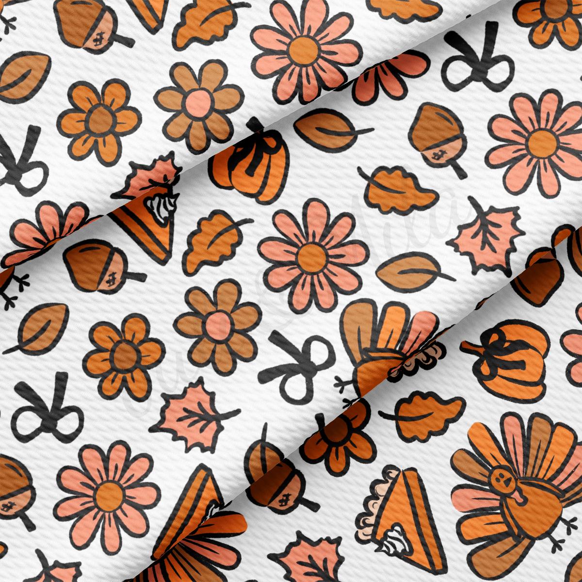 a close up of a pattern of flowers and scissors