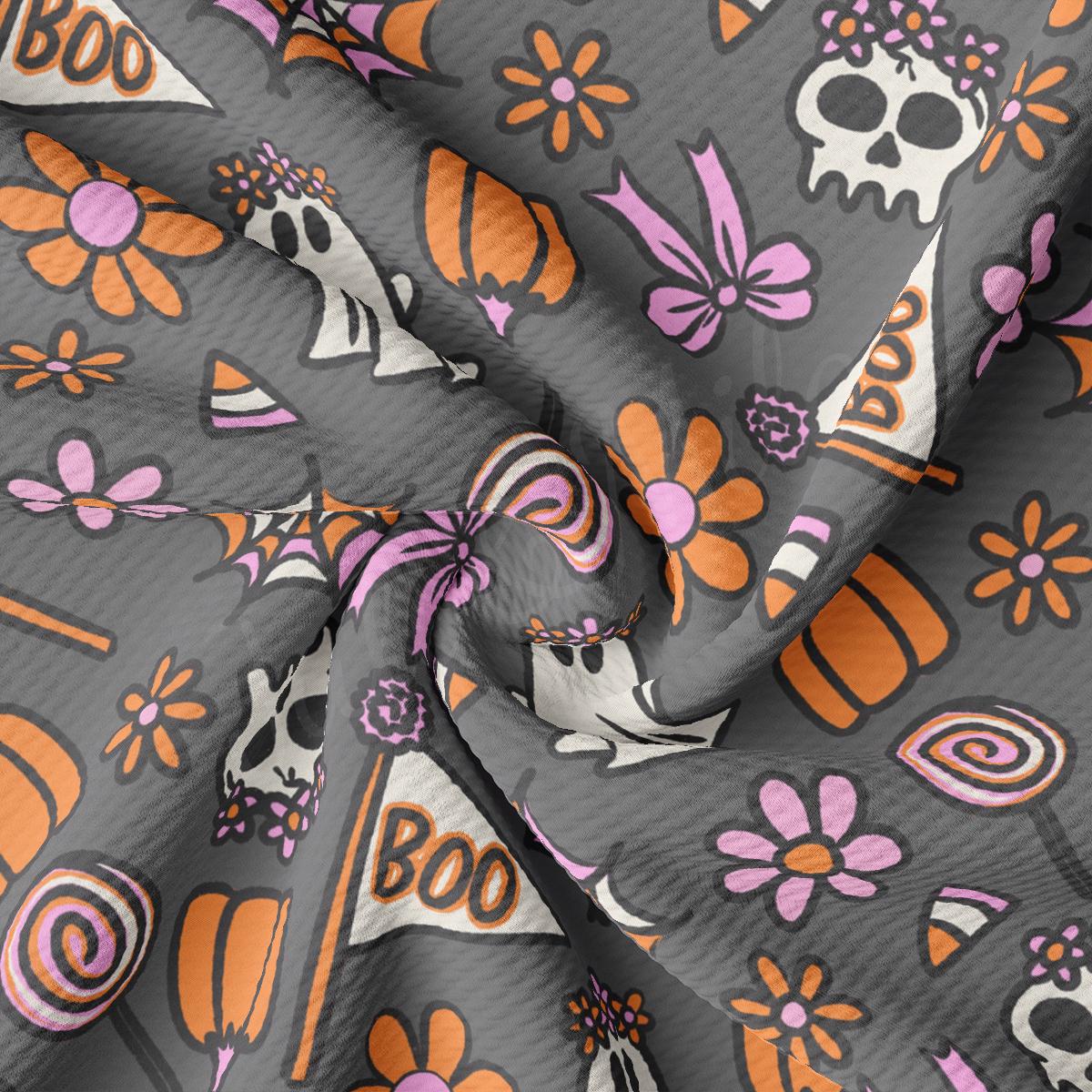 a gray and orange fabric with skulls and flowers