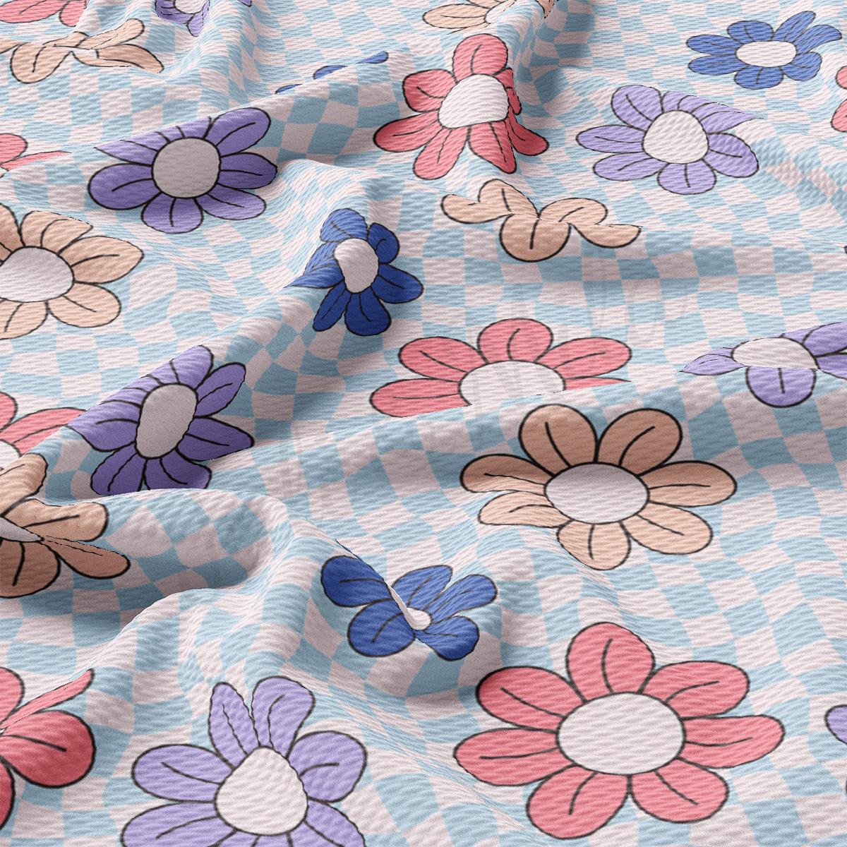 a close up of a blue and pink flowered fabric