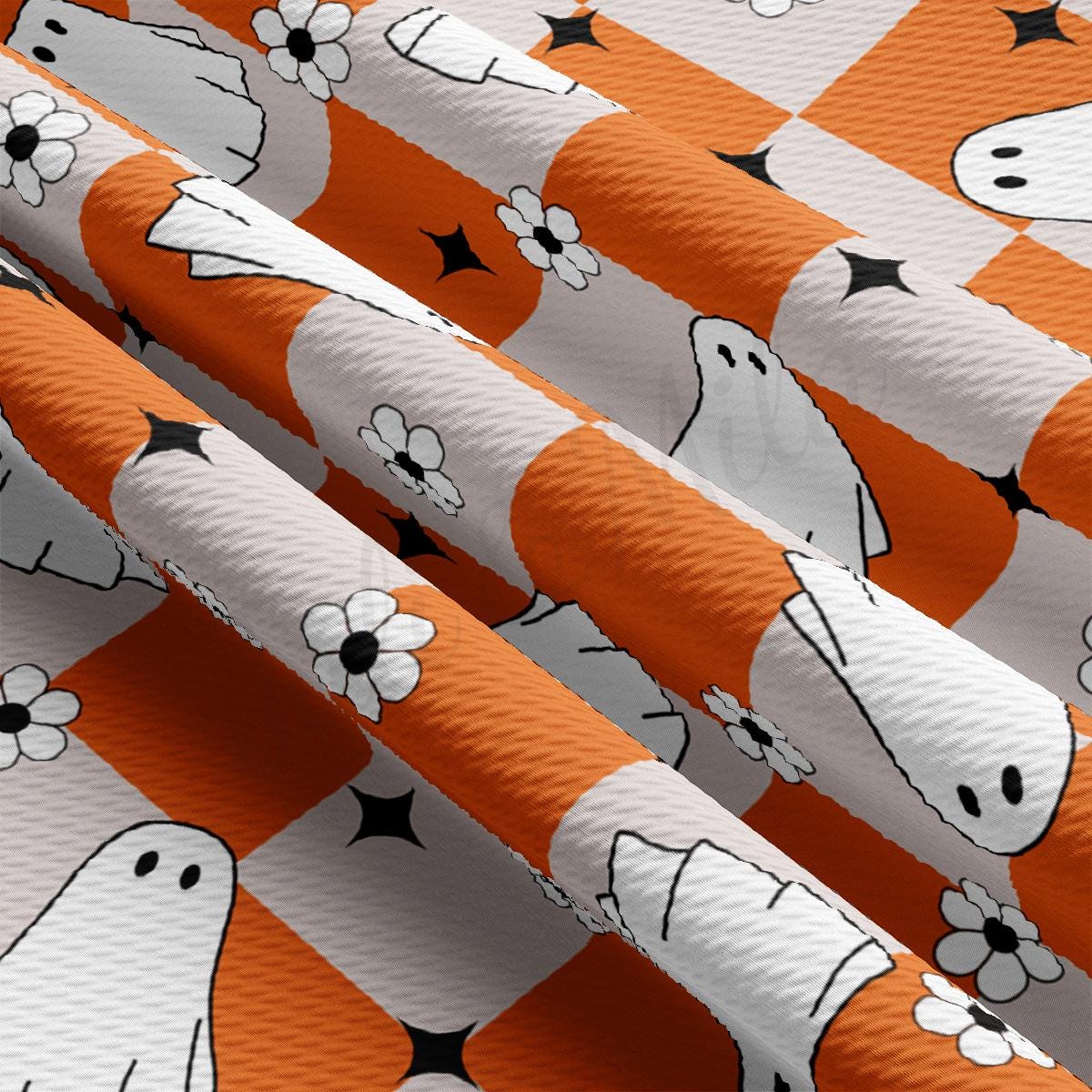 a close up of a pattern of orange and white fabric