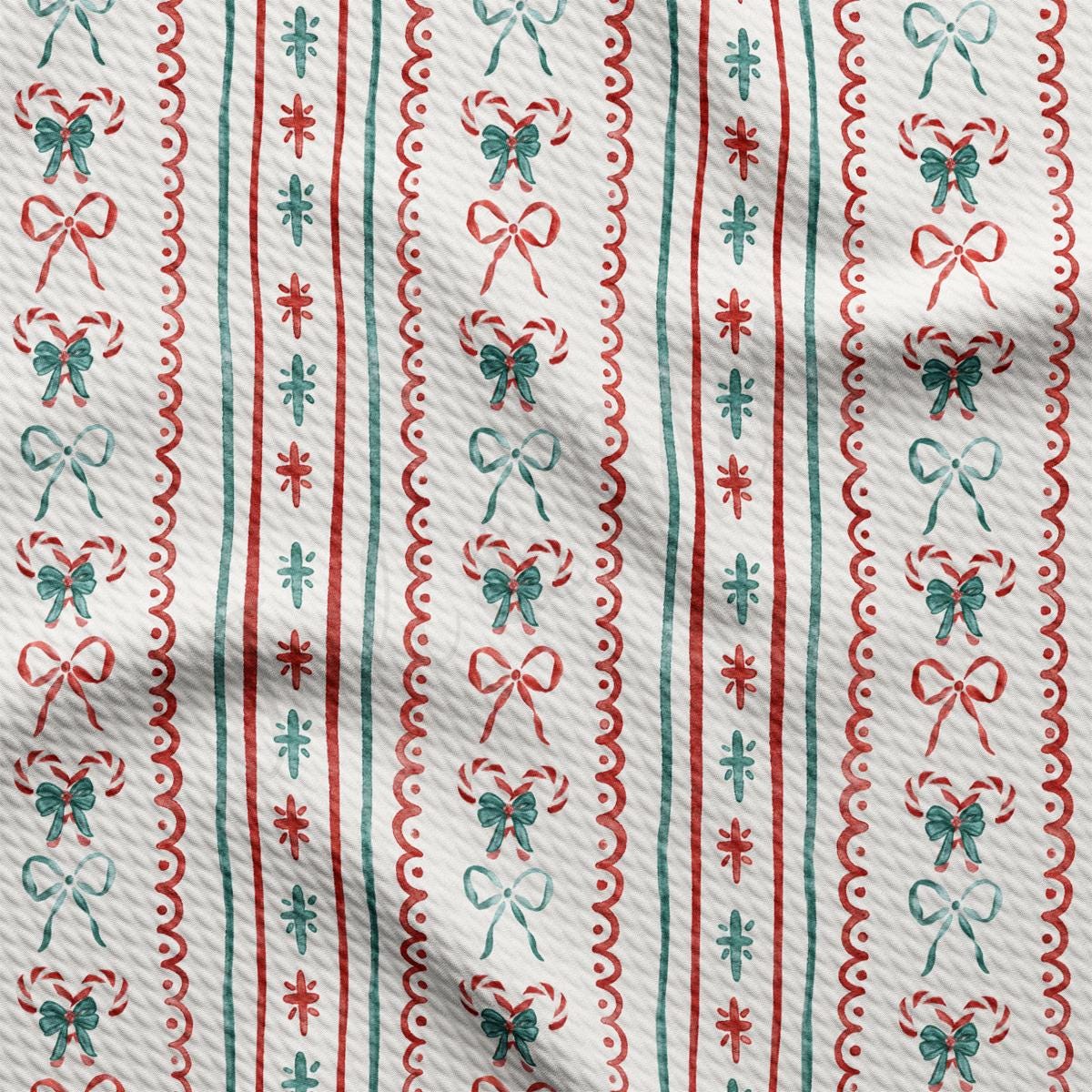 a red and green striped fabric with bows