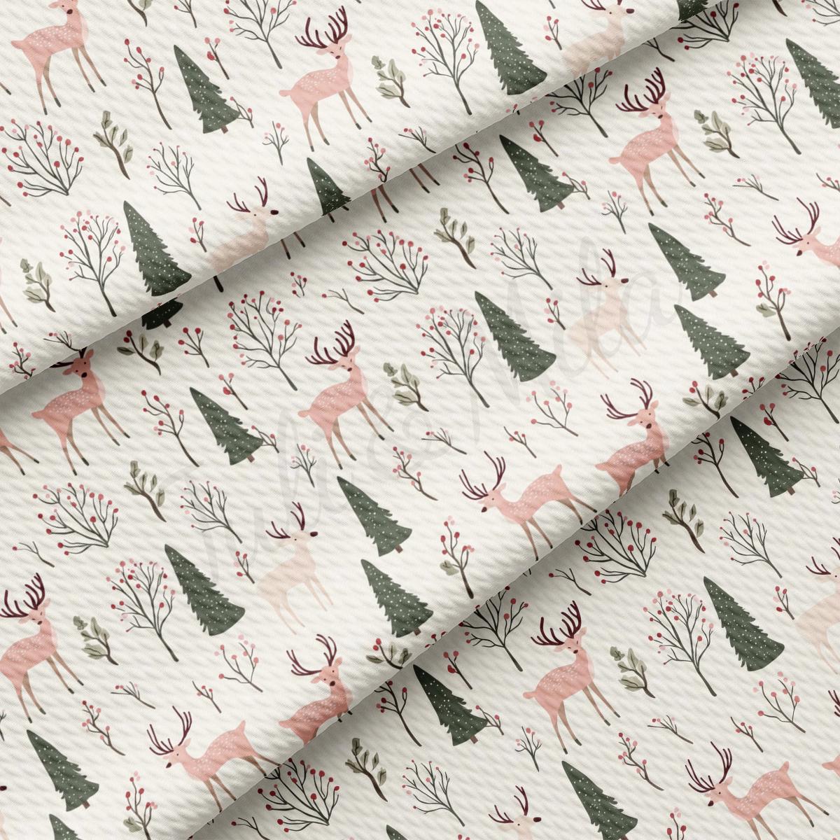 a pattern of deer and trees on a white background