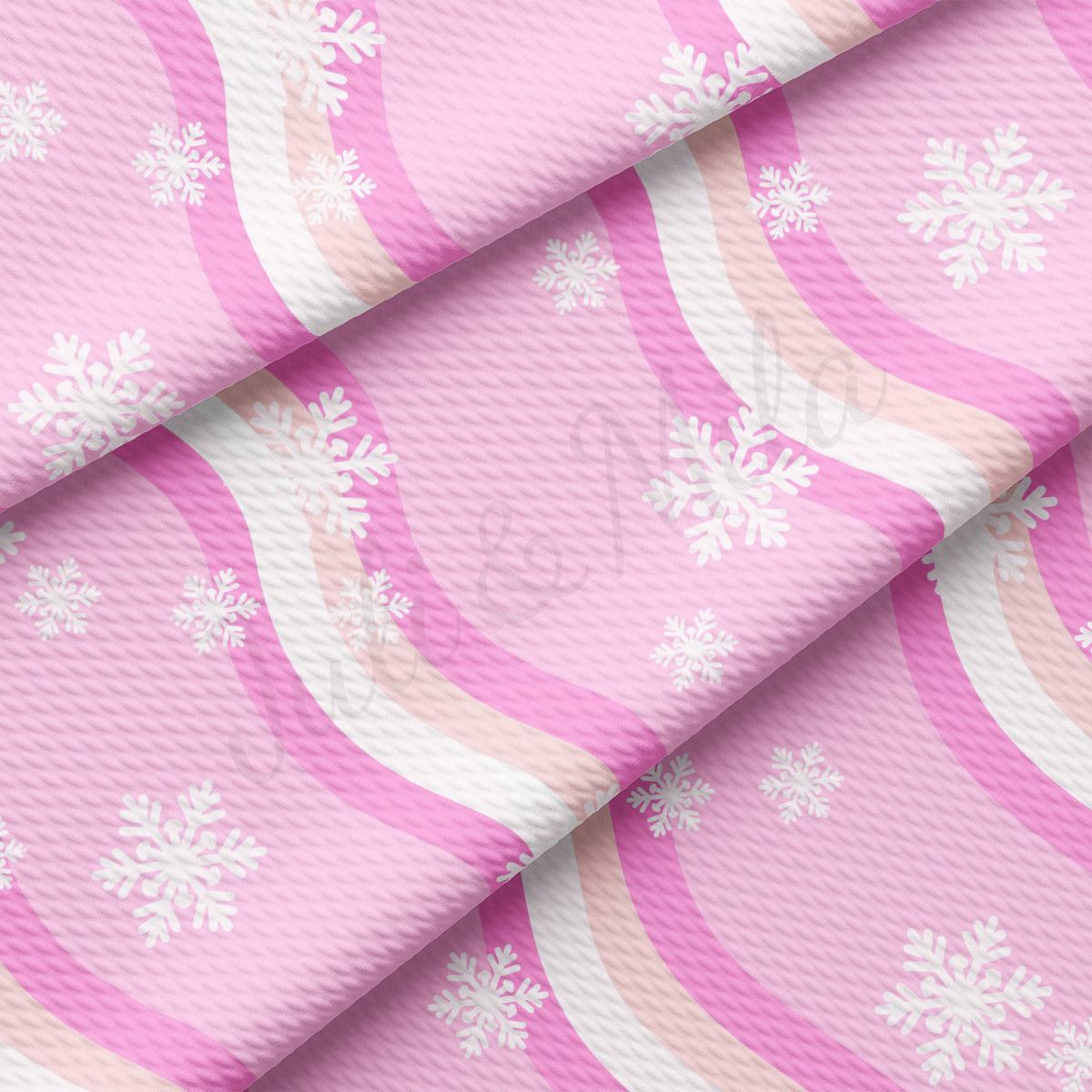 a pink background with white snowflakes on it