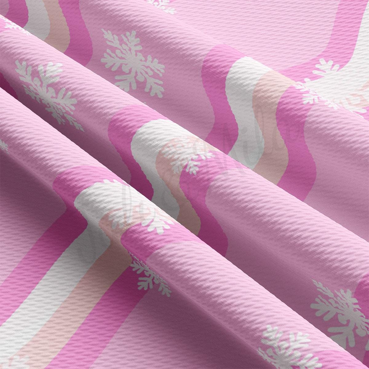 a pink and white snowflake pattern on a pink background