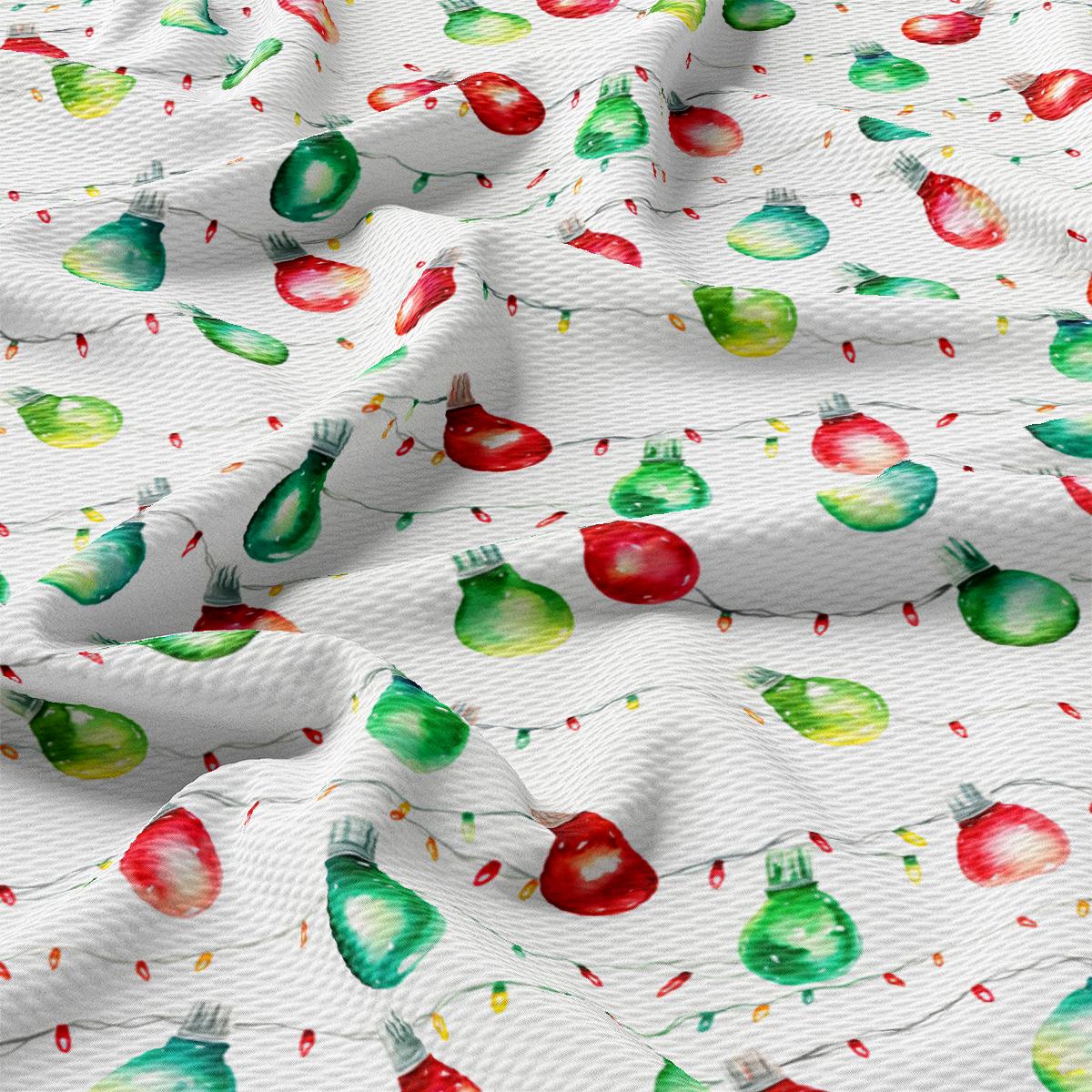 a close up of a white fabric with apples on it