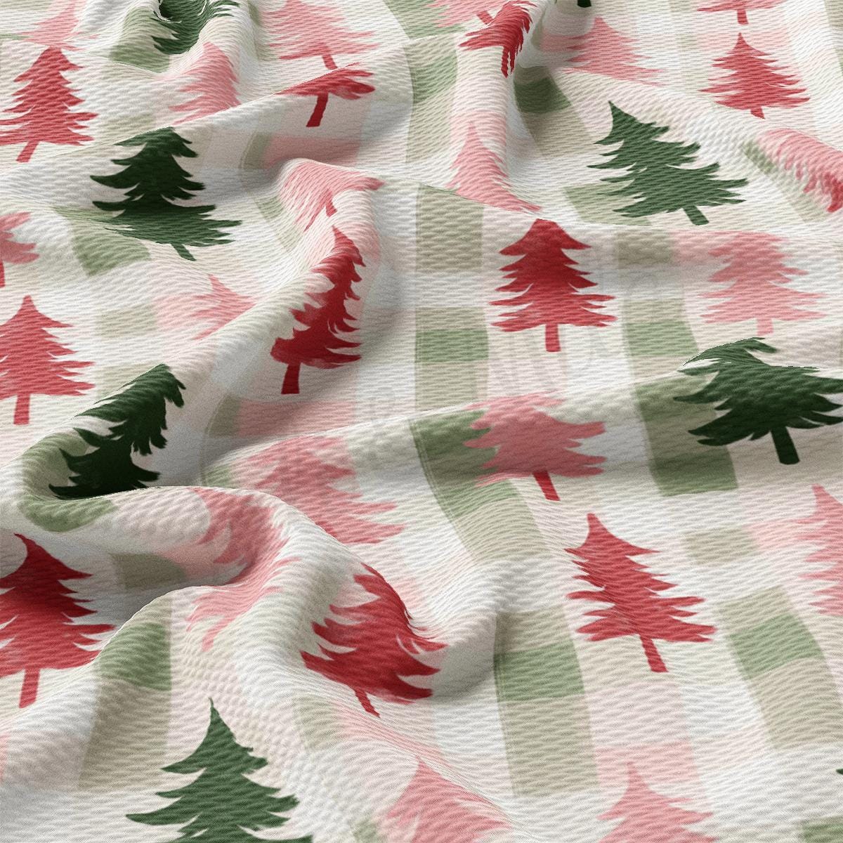 a close up of a fabric with trees on it