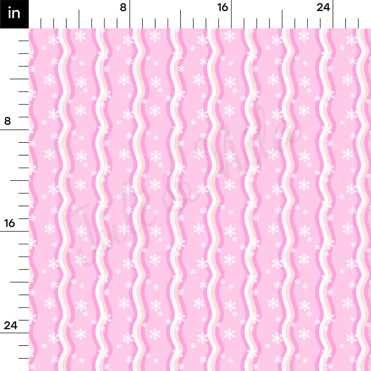 a pink and white striped background with snowflakes